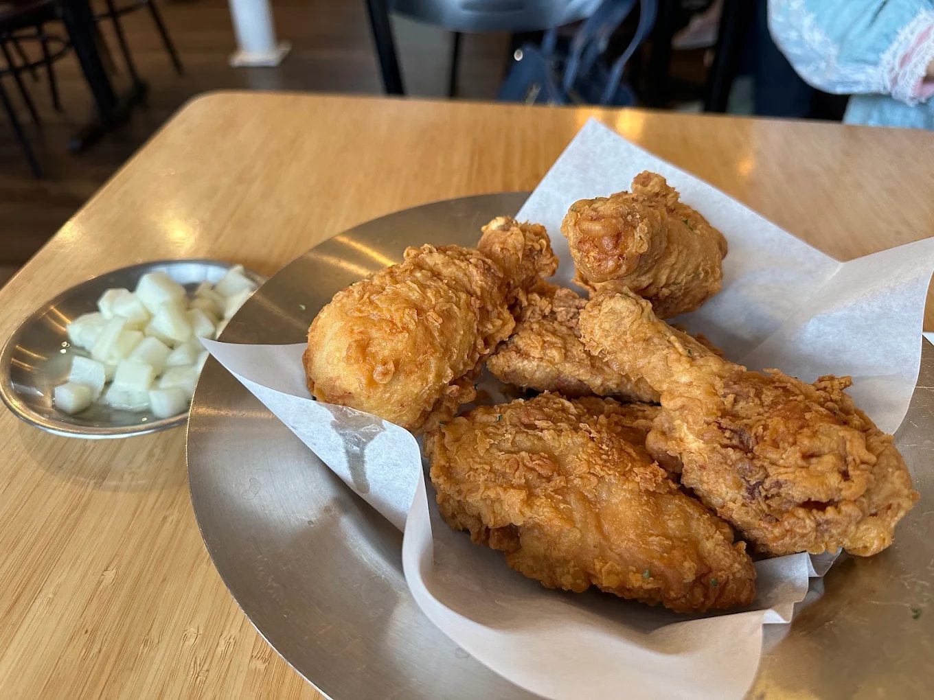 Korean fried chicken with pickled radish on the table