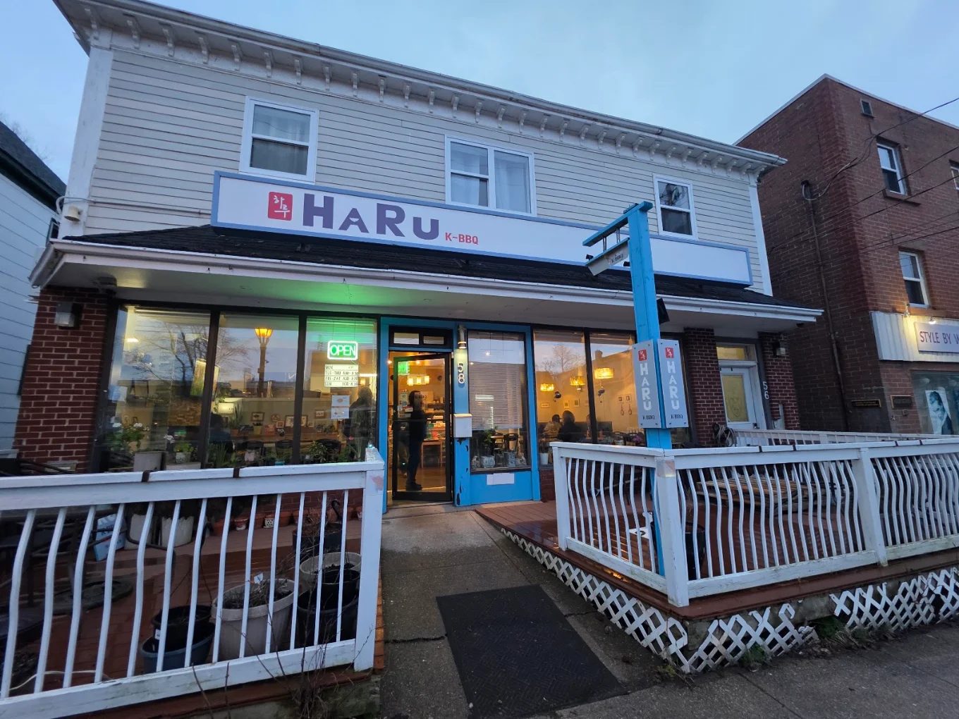 Haru K-BBQ storefront lit up in the evening